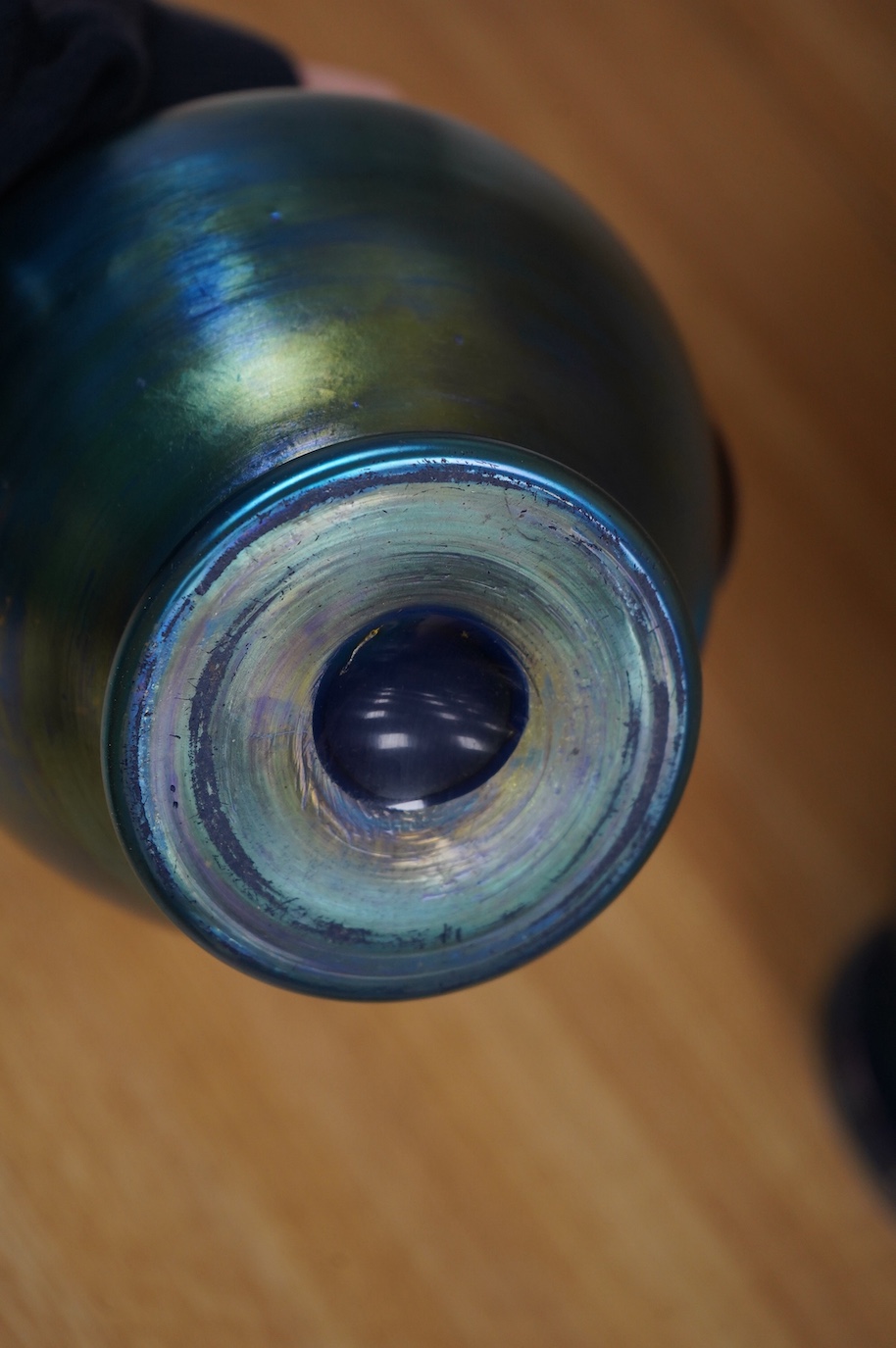 A Loetz cobalt Papillon iridescent glass footed hexagonal bowl, a Kralik blue iridescent vase and a large Bohemian iridescent glass jug (3) tallest 21cm. Condition - good